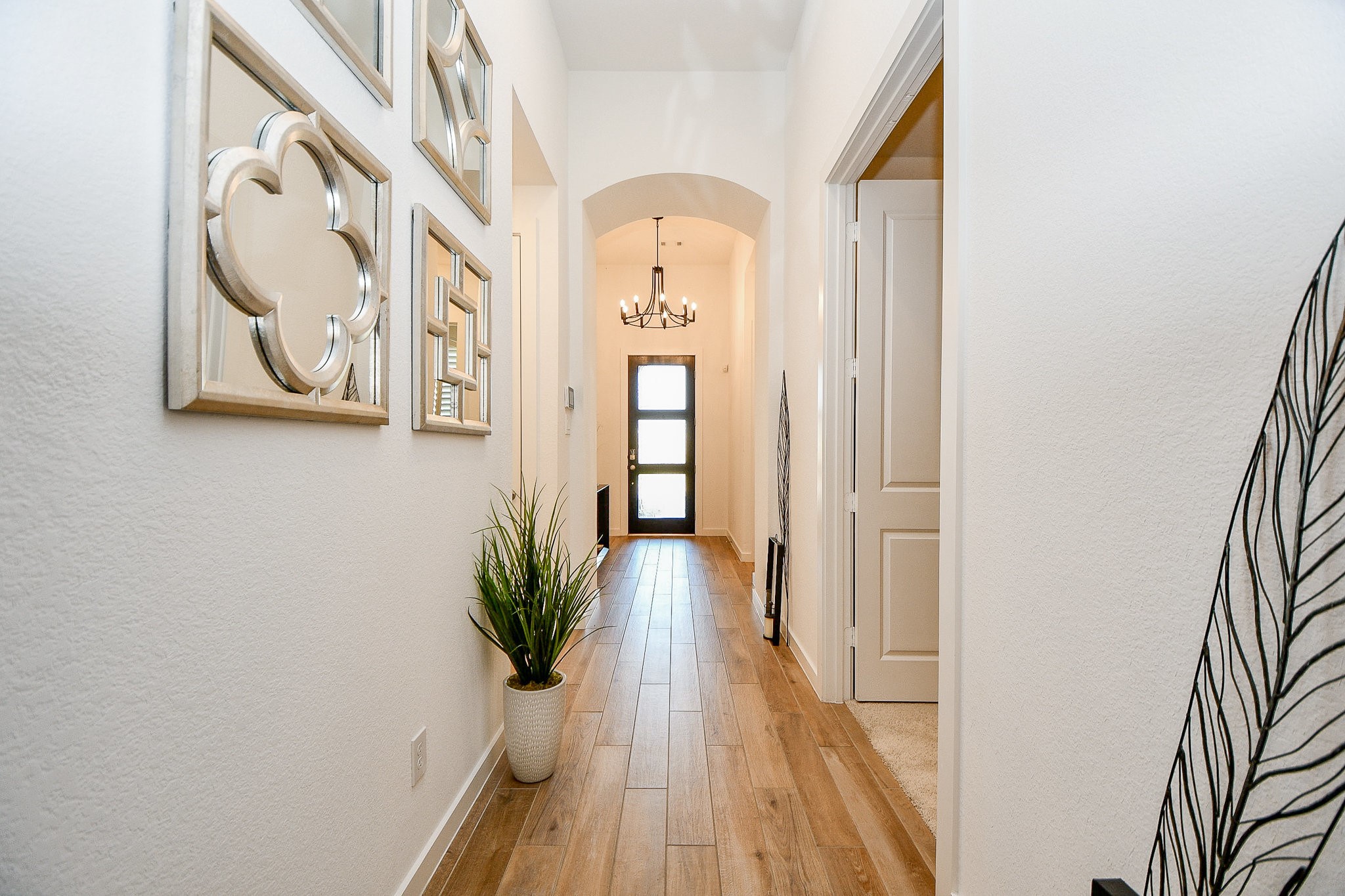 5102 Pomegranate Path Manvel, TX 77578 - Photo 6 of 33 a view of a hallway with wooden floor