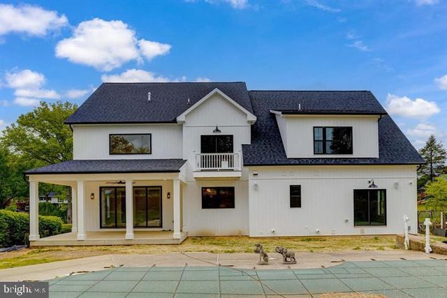 a house that has a tree in front of it