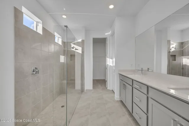 a bathroom with a double vanity sink mirror and double