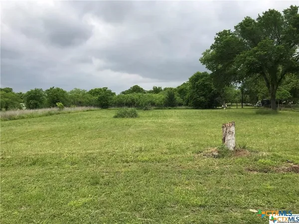 a fire hydrant in the middle of a field