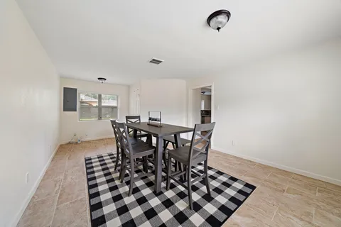 a view of a dining room with furniture