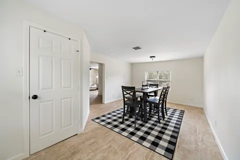 a view of a dining room with furniture