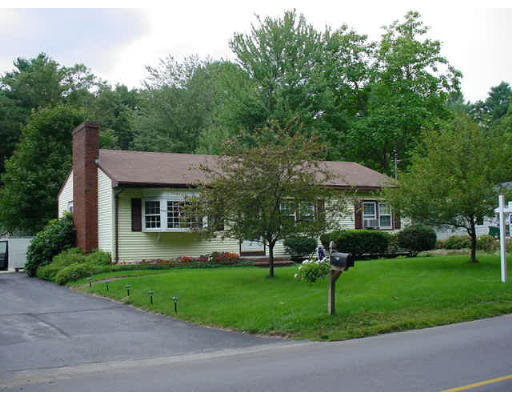 102 Folly Mill Road Salisbury, MA 01952 - Photo 1 of 9 a front view of a house with a yard table and chairs