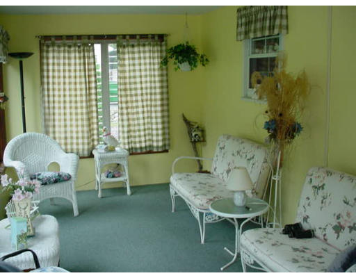 102 Folly Mill Road Salisbury, MA 01952 - Photo 6 of 9 a living room with furniture and a potted plant