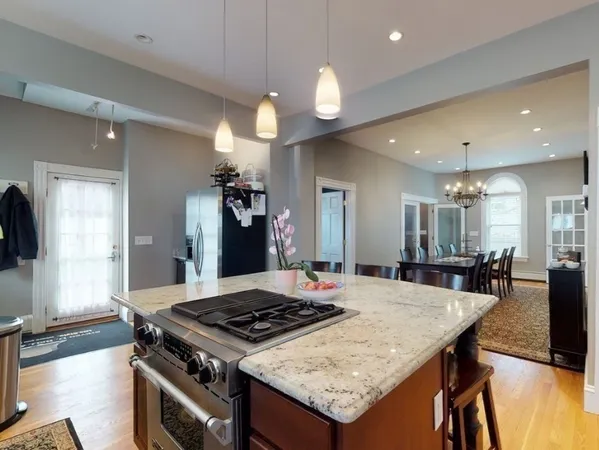 a kitchen with a dining table and chairs