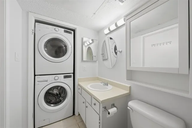 a view of a bathroom with a sink and mirror