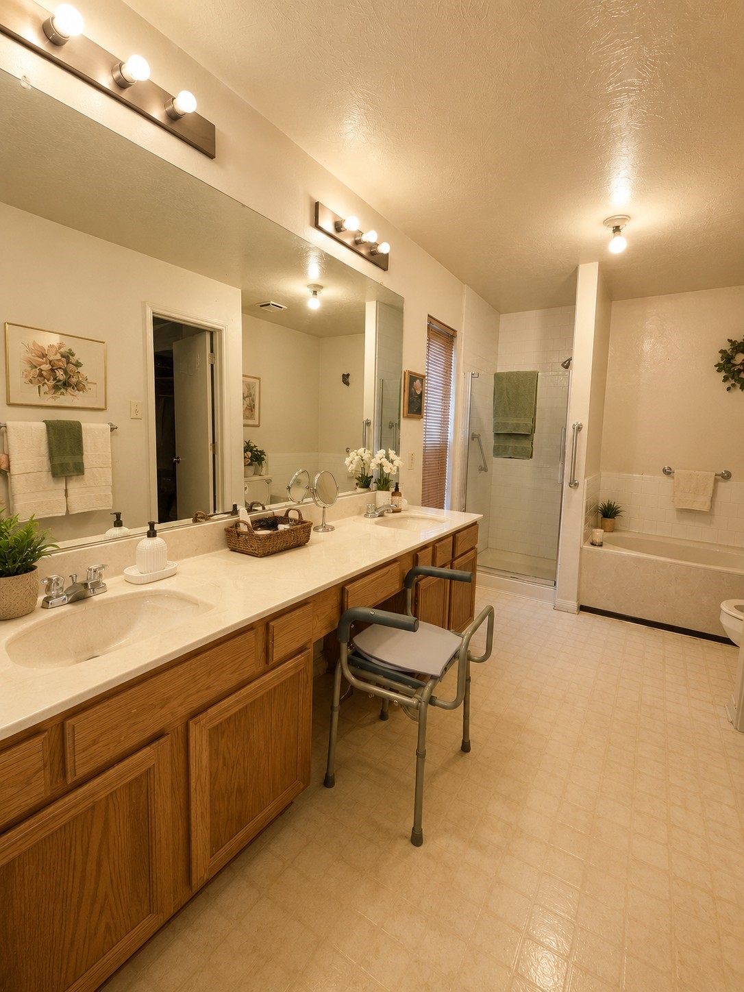 14102 Twisted Rattan Lane Houston, TX 77015 - Photo 15 of 28 Spacious primary bath featuring a long dual-sink vanity, separate walk-in shower, soaking tub, and plenty of counter and storage space.