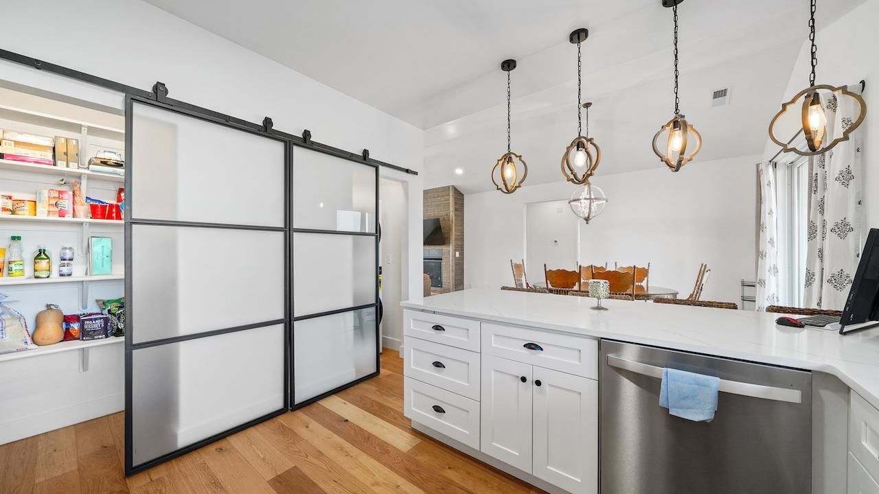 3439 D Road Palisade, CO 81526 - Photo 12 of 29 a kitchen with stainless steel appliances granite countertop a sink a refrigerator a center island and cabinets