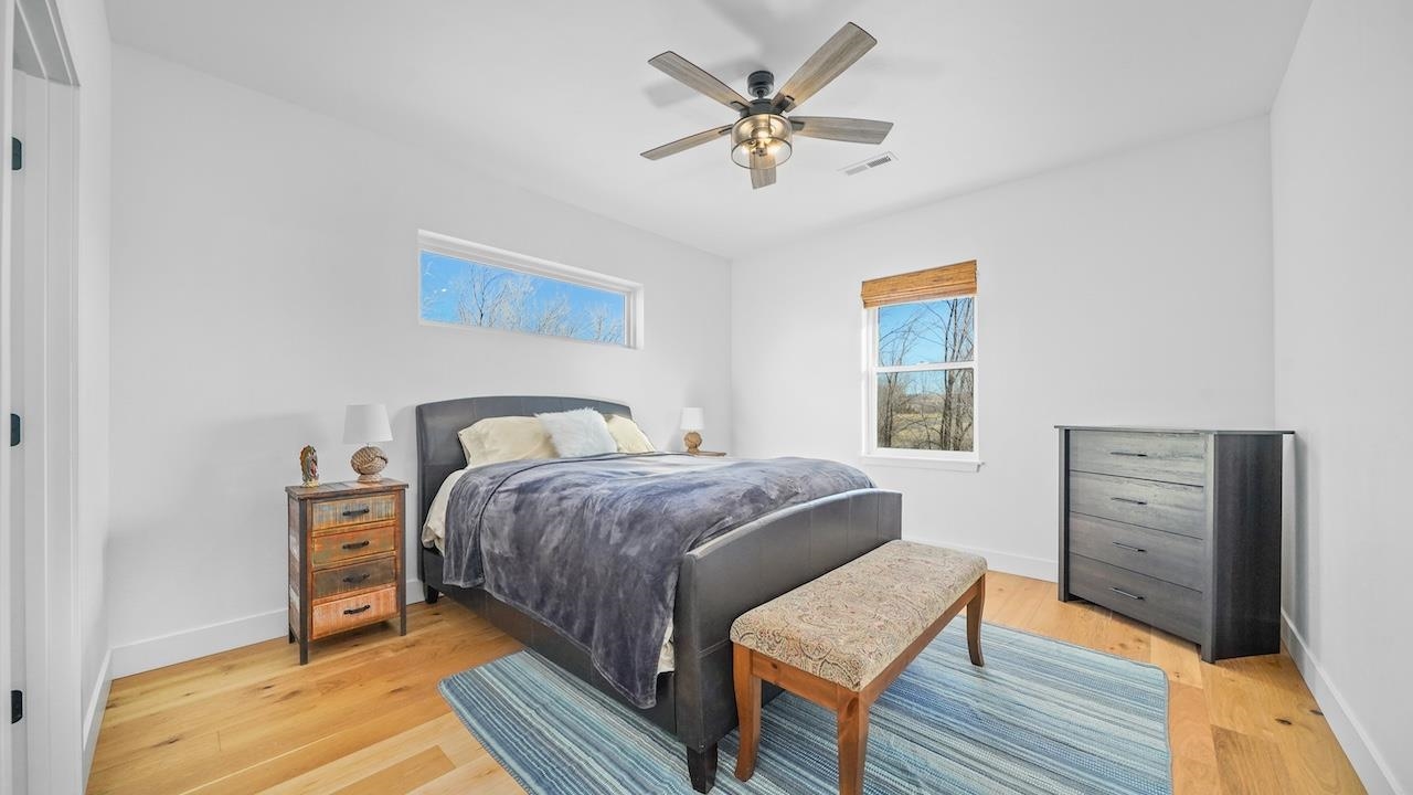 3439 D Road Palisade, CO 81526 - Photo 15 of 29 a bedroom with a bed and a dresser