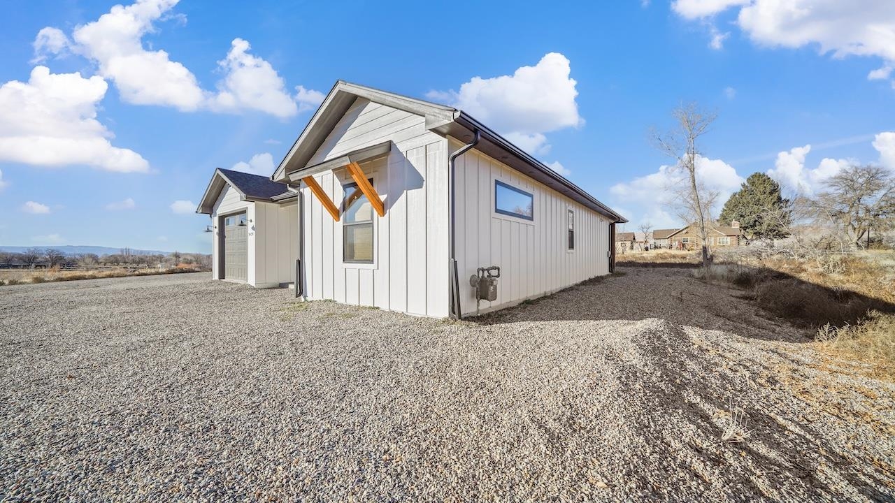 3439 D Road Palisade, CO 81526 - Photo 24 of 29 a view of a house with a yard
