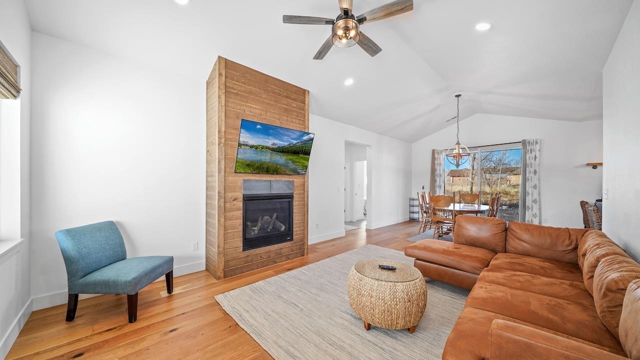 3439 D Road Palisade, CO 81526 - Photo 4 of 29 a living room with furniture and a fireplace