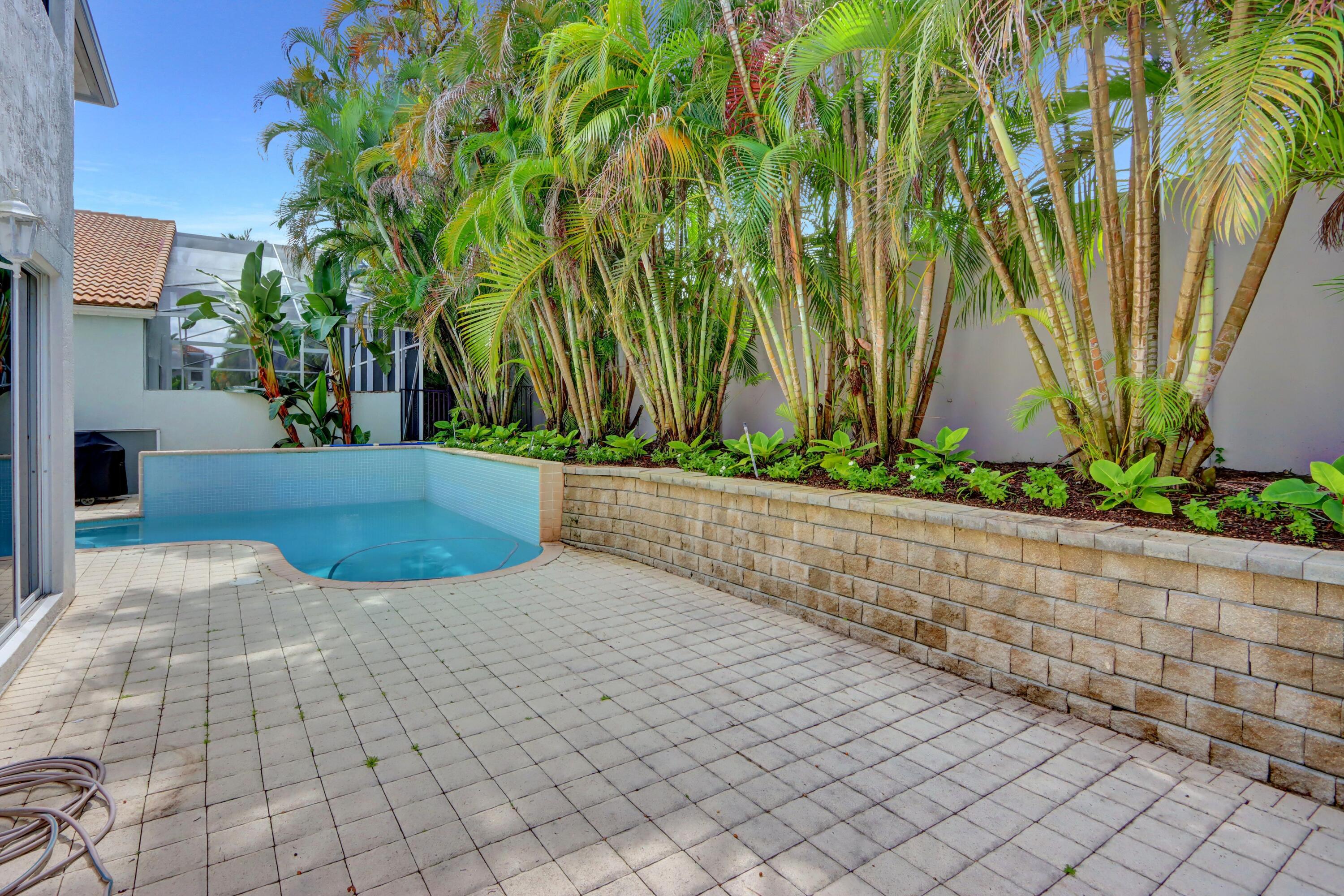 6515 Northwest 43rd Terrace Boca Raton, FL 33496 - Photo 23 of 43 Rear Patio & Pool