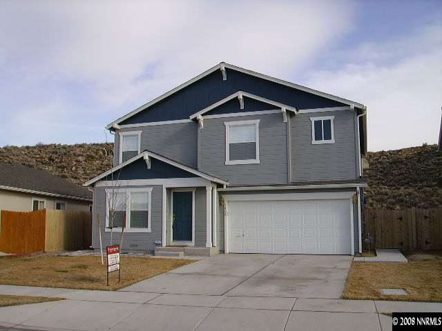 a front view of a house with yard