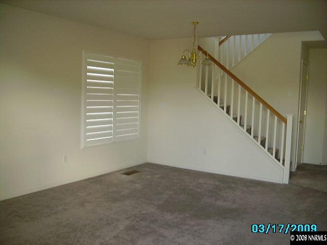 7636 Corso Street Reno, NV 89506 - Photo 4 of 8 a view of an empty room with stairs