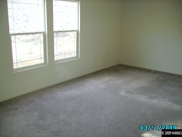 7636 Corso Street Reno, NV 89506 - Photo 5 of 8 an empty room with a window