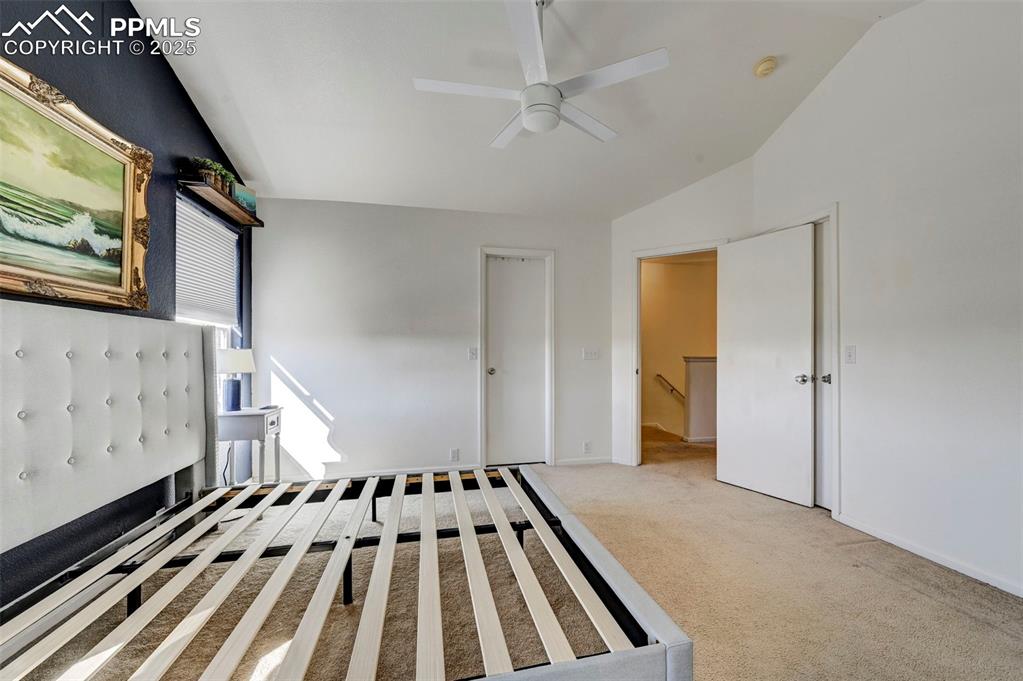 9332 Bethpage Road Peyton, CO 80831 - Photo 14 of 32 a view of a bedroom with wooden floor and windows
