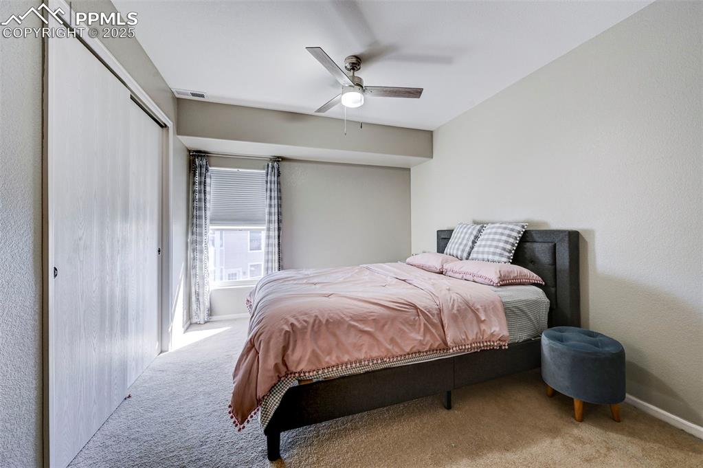 9332 Bethpage Road Peyton, CO 80831 - Photo 17 of 32 a bedroom with a bed and window