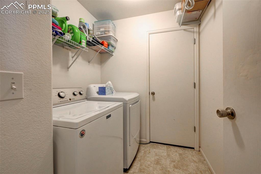 9332 Bethpage Road Peyton, CO 80831 - Photo 27 of 32 a utility room with dryer and washer