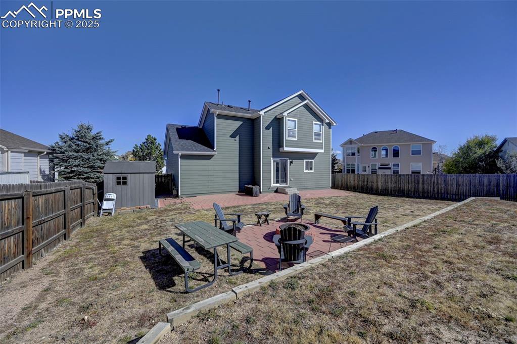 9332 Bethpage Road Peyton, CO 80831 - Photo 28 of 32 a view of a house with wooden fence