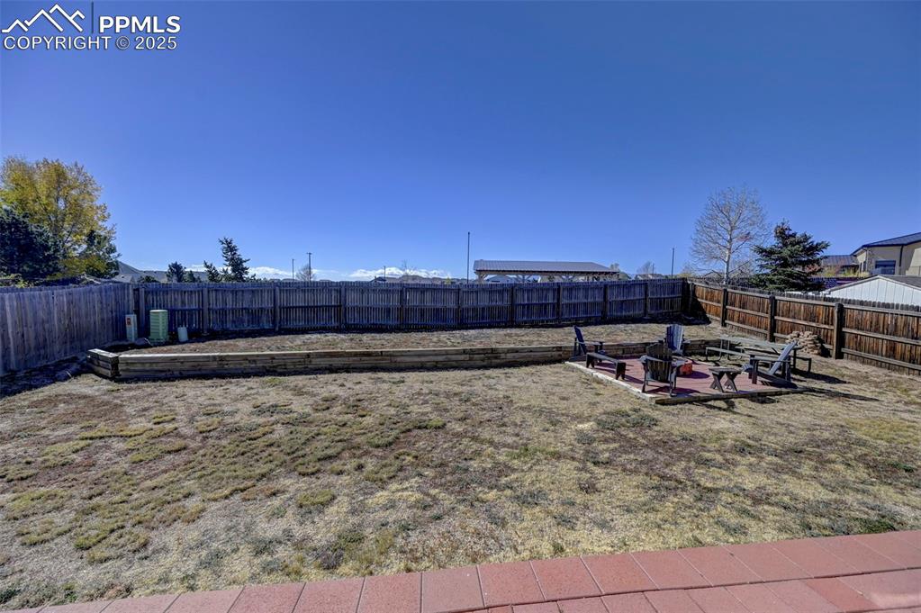 9332 Bethpage Road Peyton, CO 80831 - Photo 30 of 32 a view of a backyard with sitting area