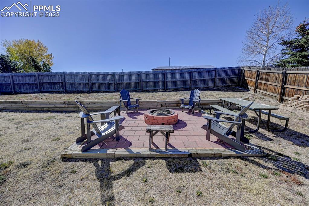 9332 Bethpage Road Peyton, CO 80831 - Photo 31 of 32 a view of a chairs and table in the patio
