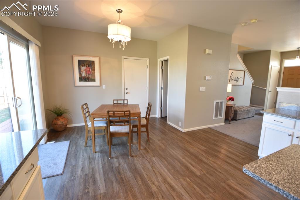 9332 Bethpage Road Peyton, CO 80831 - Photo 9 of 32 a workspace with wooden floor