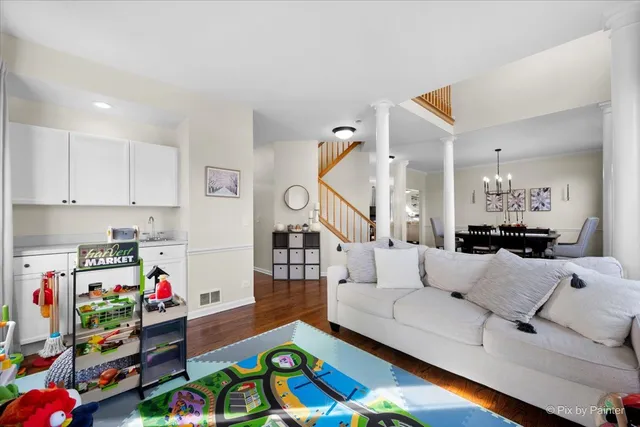 a view of a dining room with furniture window and wooden floor