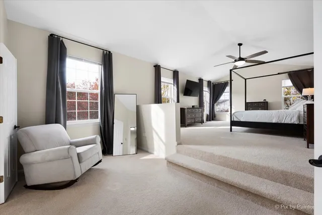 a spacious bathroom with a tub sink mirror and vanity