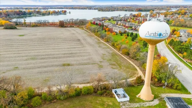 a view of swimming pool with a table and chairs