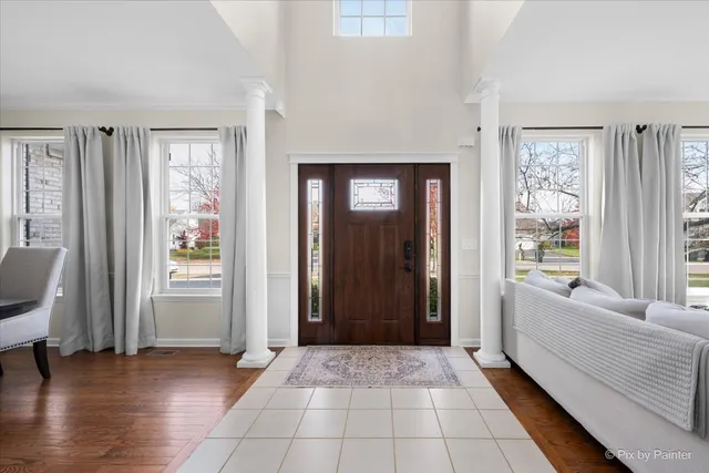a view of a dining room and hall with wooden floor
