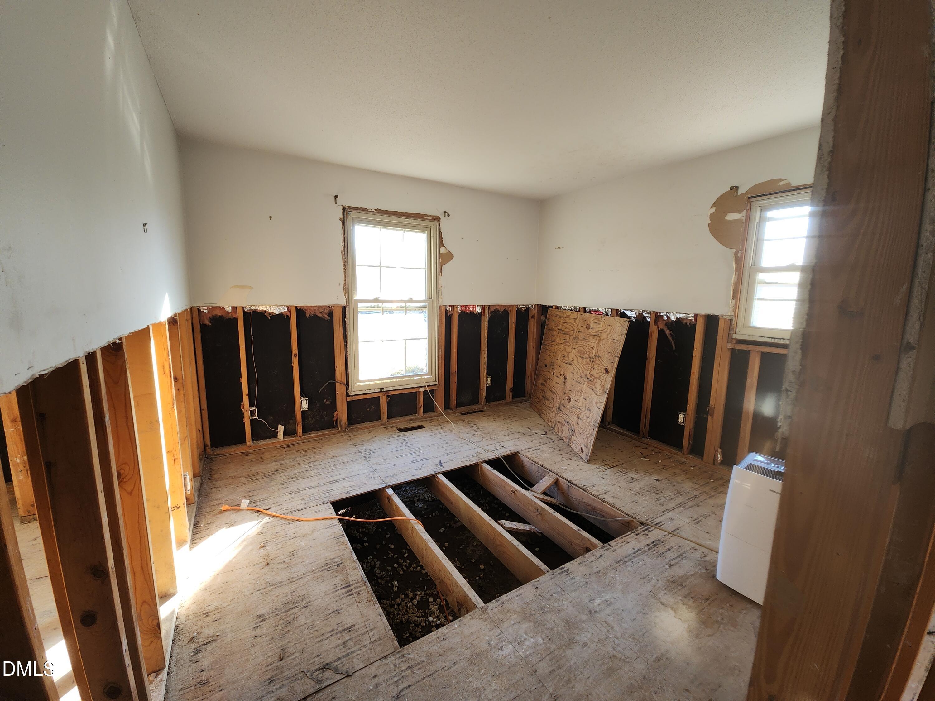 309 Rippling Stream Road Durham, NC 27704 - Photo 17 of 36 a view of kitchen with furniture and a refrigerator