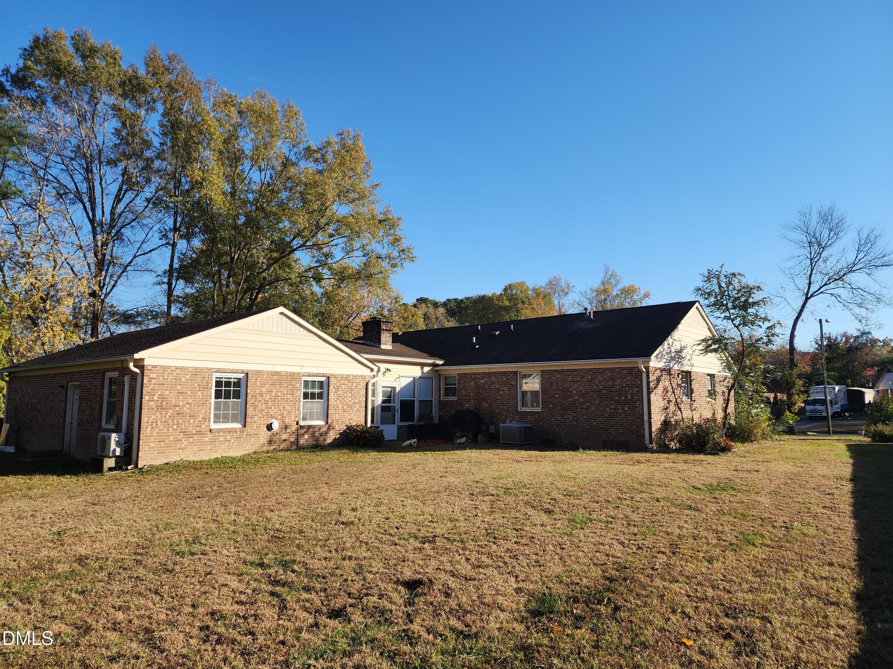 309 Rippling Stream Road Durham, NC 27704 - Photo 2 of 36 a front view of a house with a yard