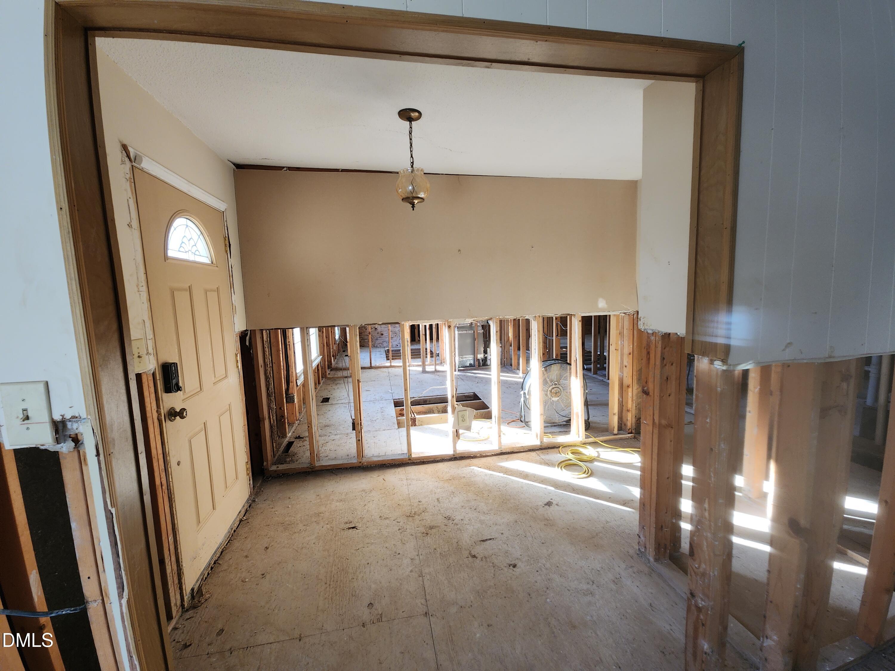 309 Rippling Stream Road Durham, NC 27704 - Photo 25 of 36 a view of an empty room with a fireplace
