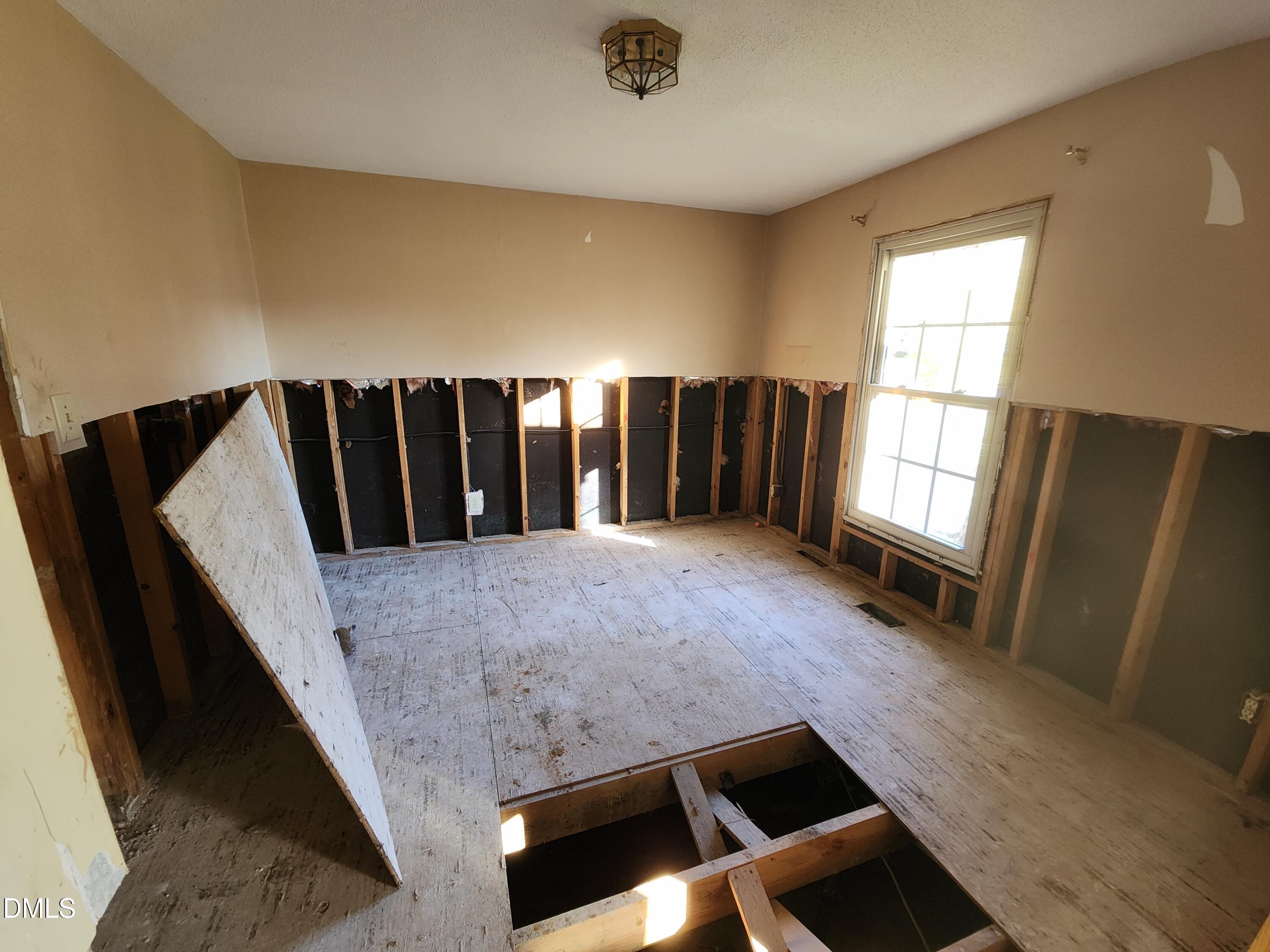 309 Rippling Stream Road Durham, NC 27704 - Photo 26 of 36 a view of furniture and hall with wooden floor