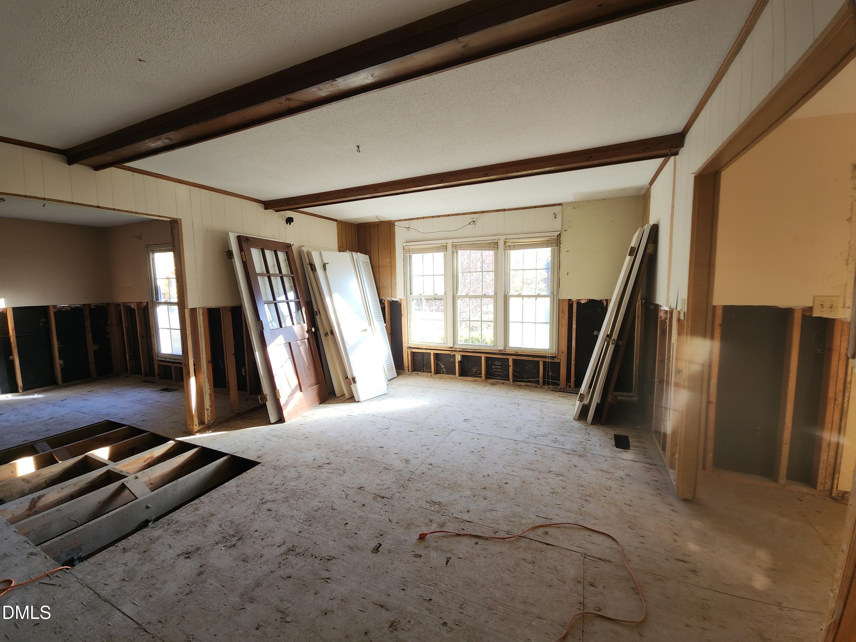 309 Rippling Stream Road Durham, NC 27704 - Photo 27 of 36 a view of a hall with an entryway
