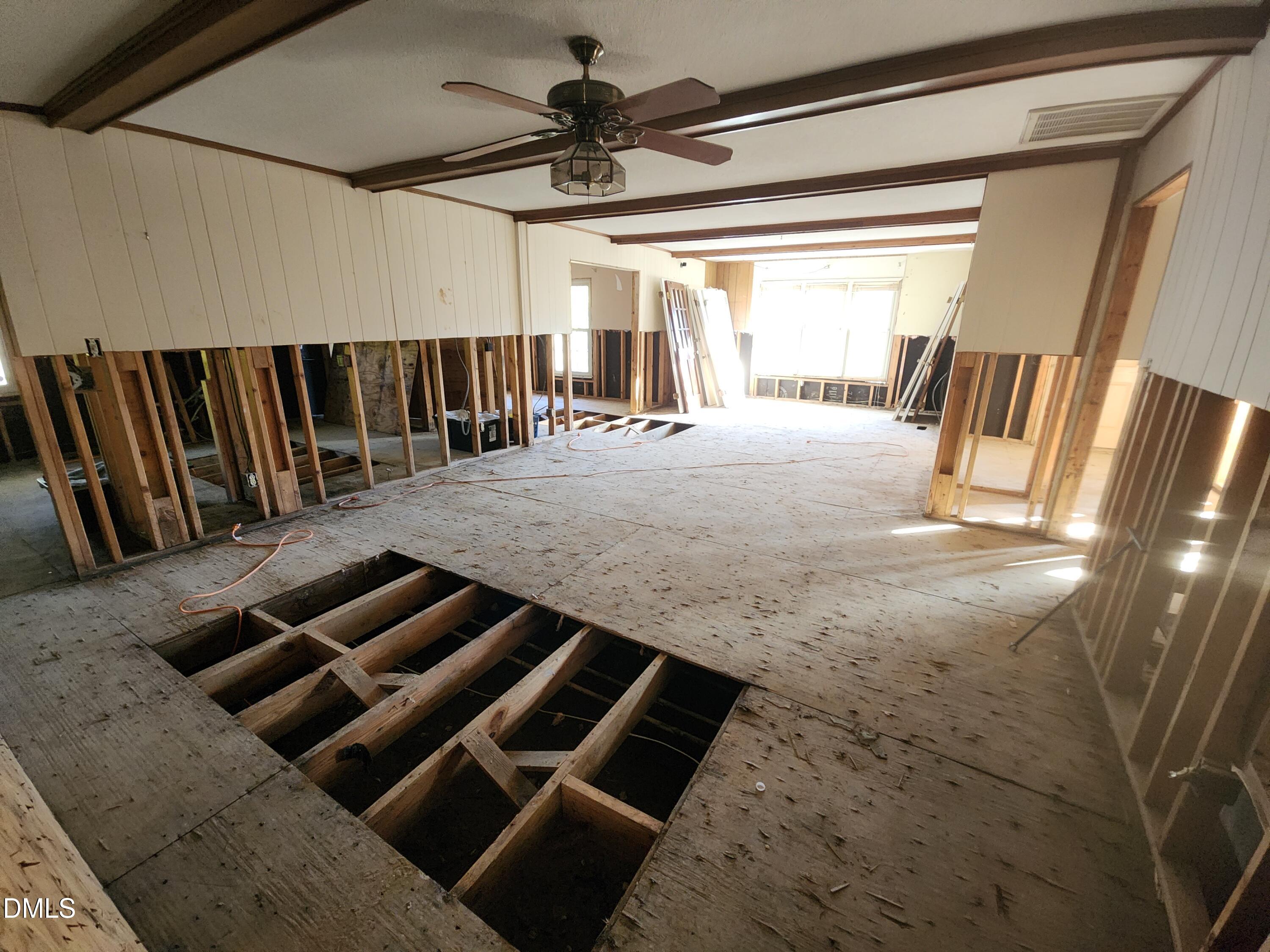 309 Rippling Stream Road Durham, NC 27704 - Photo 29 of 36 a view of wooden floor in a house