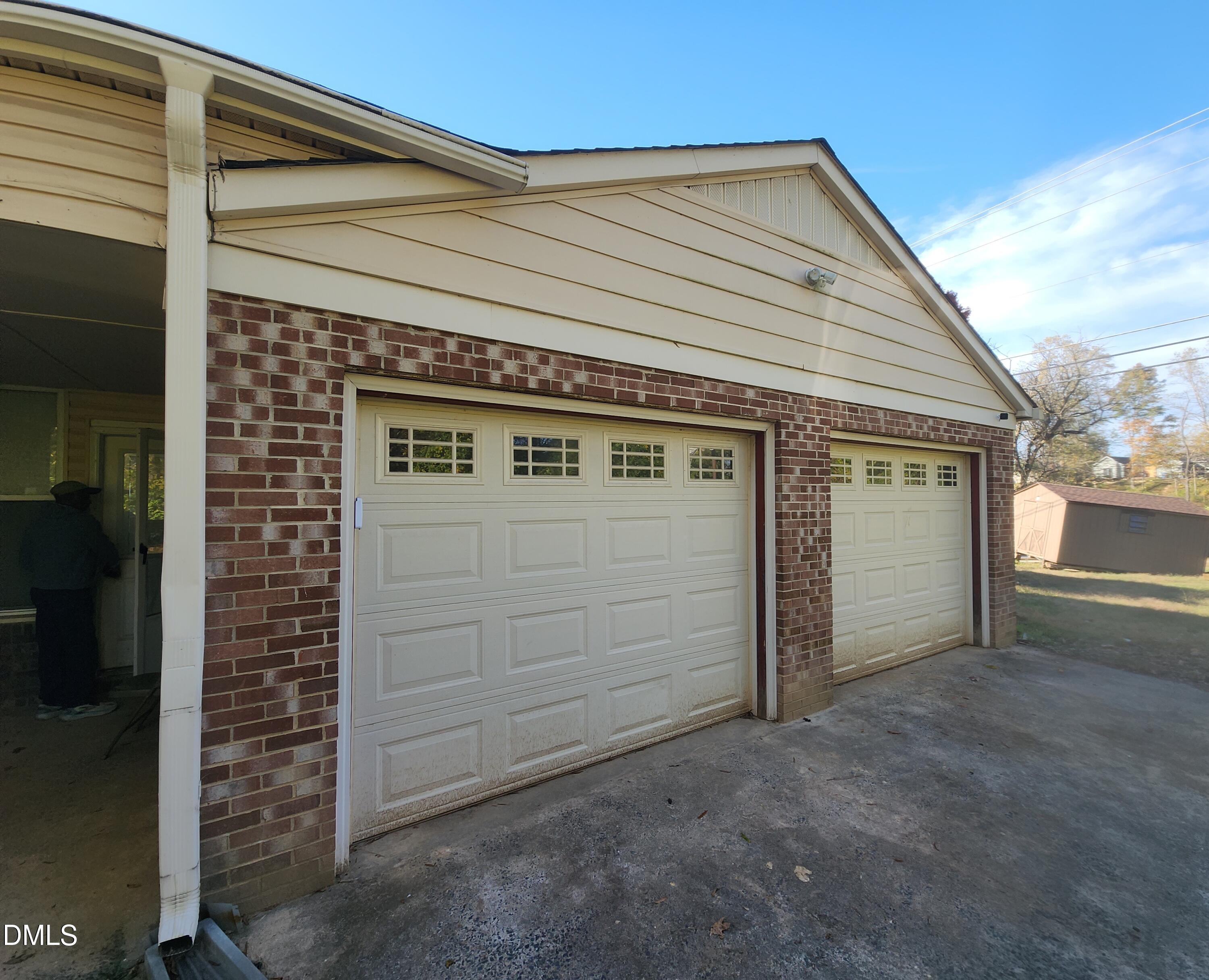 309 Rippling Stream Road Durham, NC 27704 - Photo 4 of 36 a view of a house with a garage