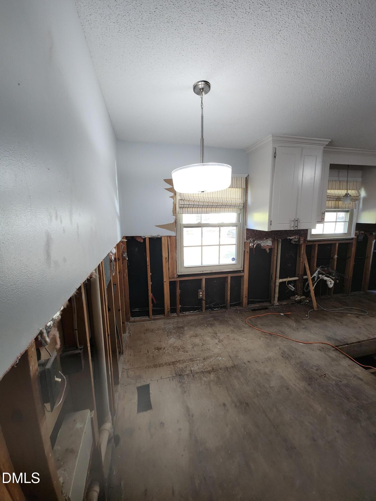 309 Rippling Stream Road Durham, NC 27704 - Photo 9 of 36 a view of a livingroom with a staircase