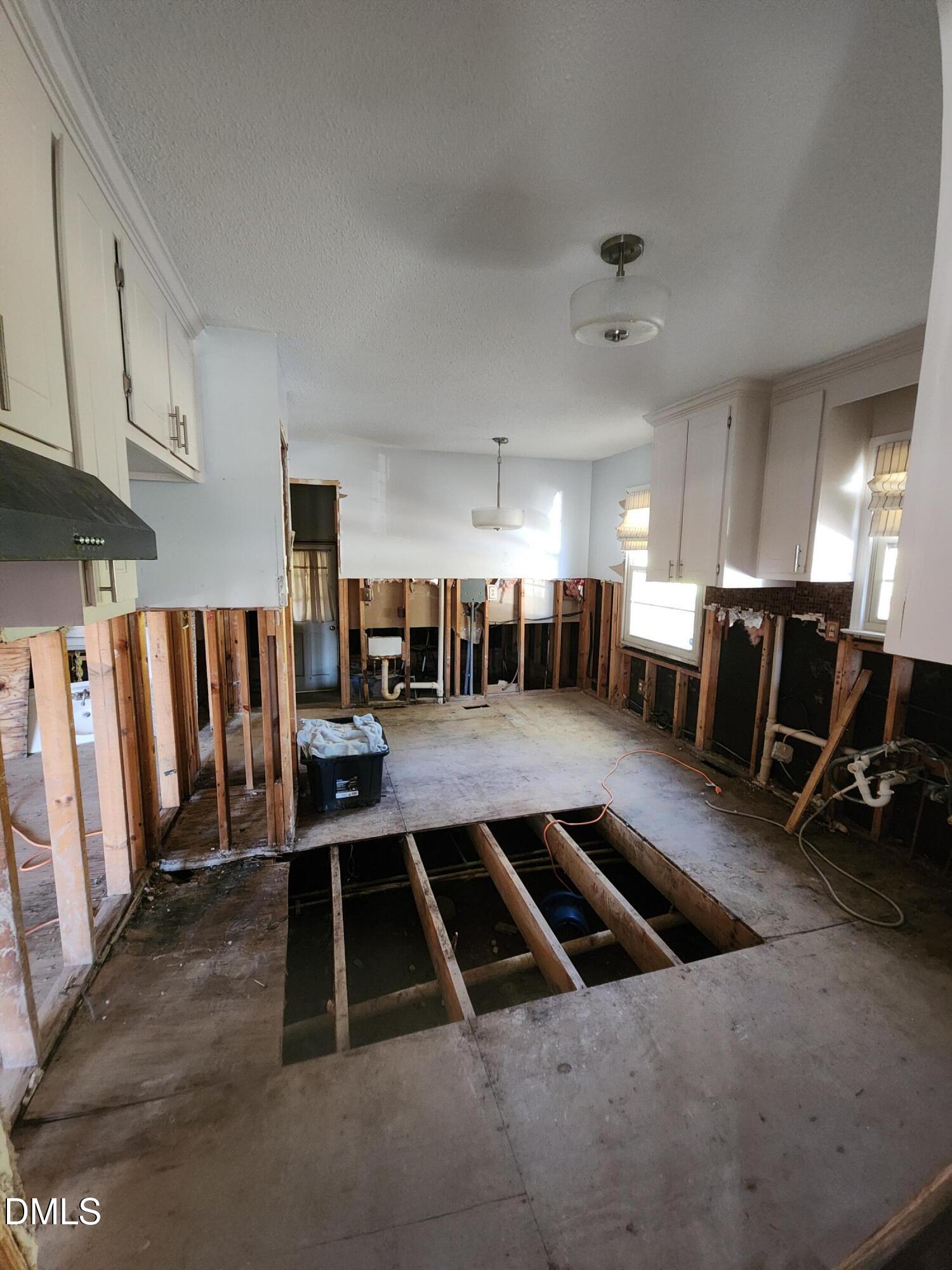 309 Rippling Stream Road Durham, NC 27704 - Photo 10 of 36 a room with lots of chairs and mirrors