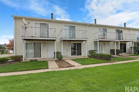 a view of a yard in front of a house