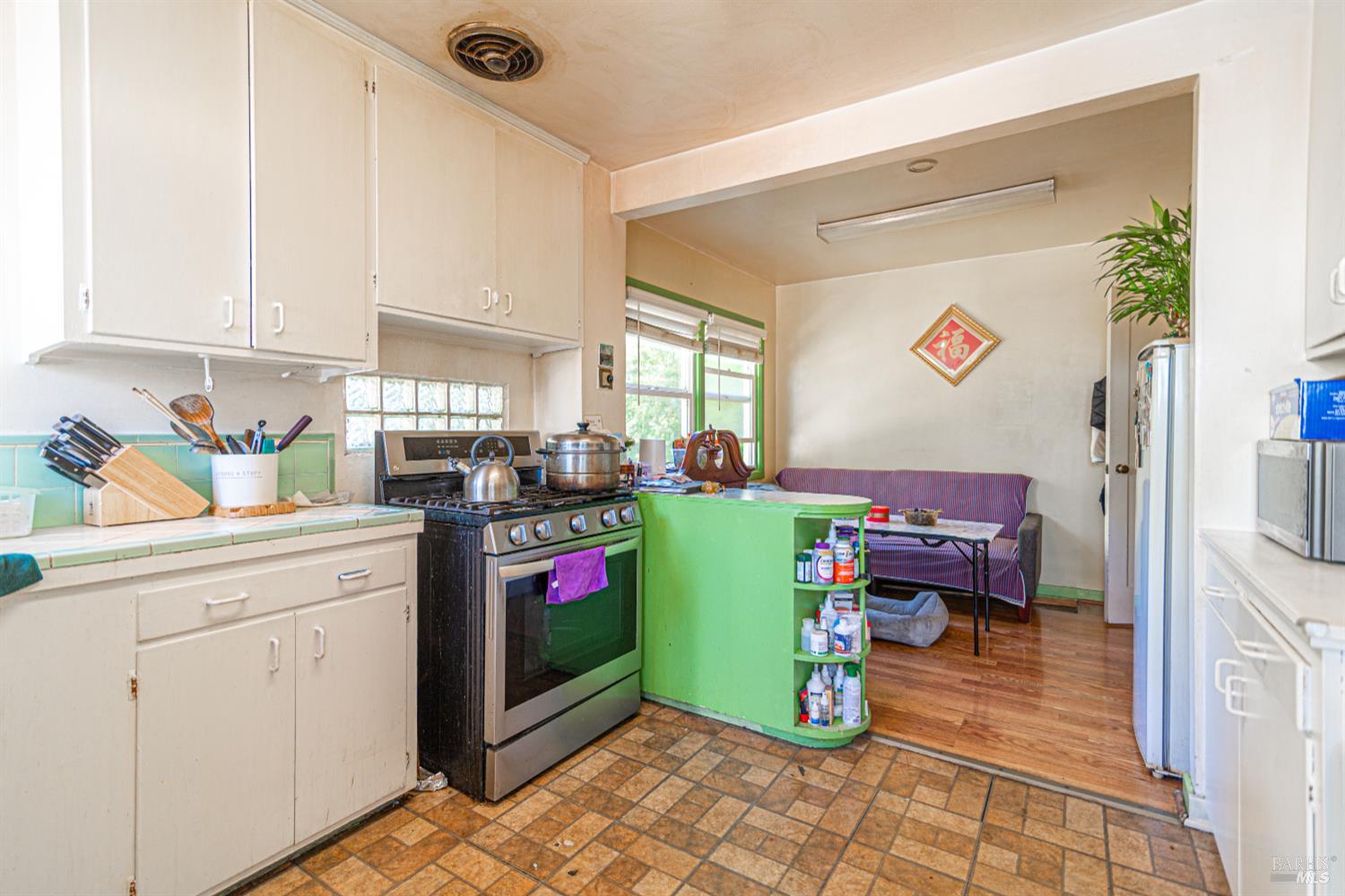 1852 4th Street Santa Rosa, CA 95404 - Photo 15 of 39 a kitchen with a refrigerator and a stove top oven