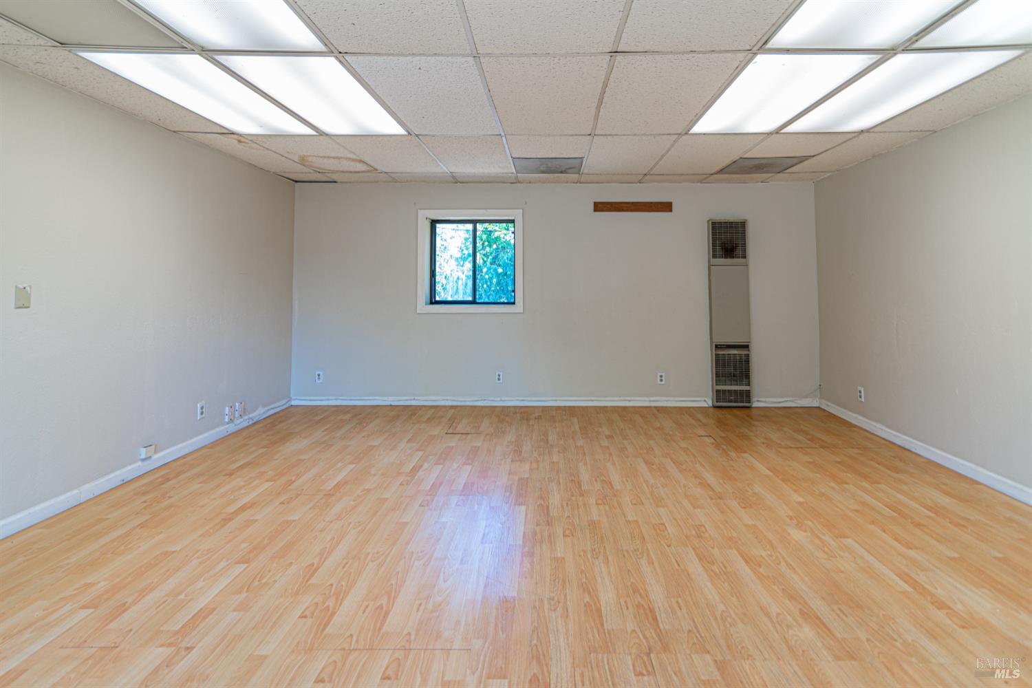 1852 4th Street Santa Rosa, CA 95404 - Photo 25 of 39 a view of empty room with wooden floor and fan