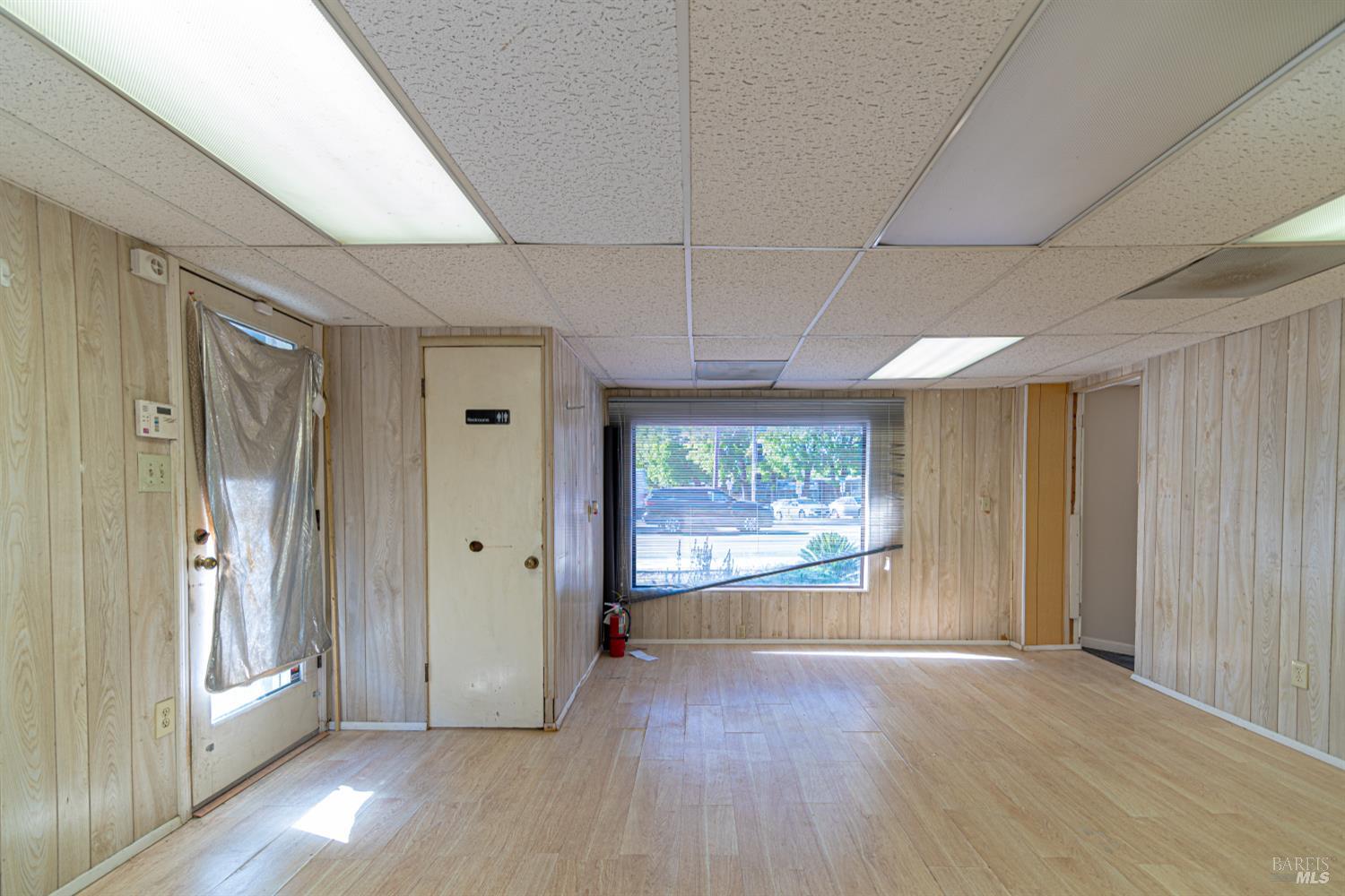 1852 4th Street Santa Rosa, CA 95404 - Photo 29 of 39 an empty room with wooden floor and windows