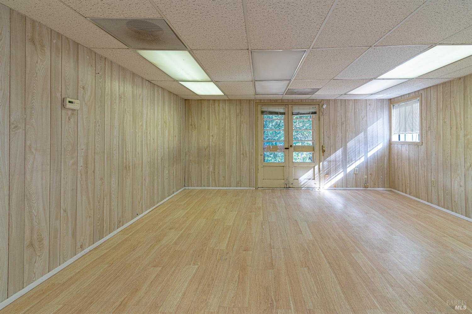 1852 4th Street Santa Rosa, CA 95404 - Photo 30 of 39 an empty room with wooden floor and windows