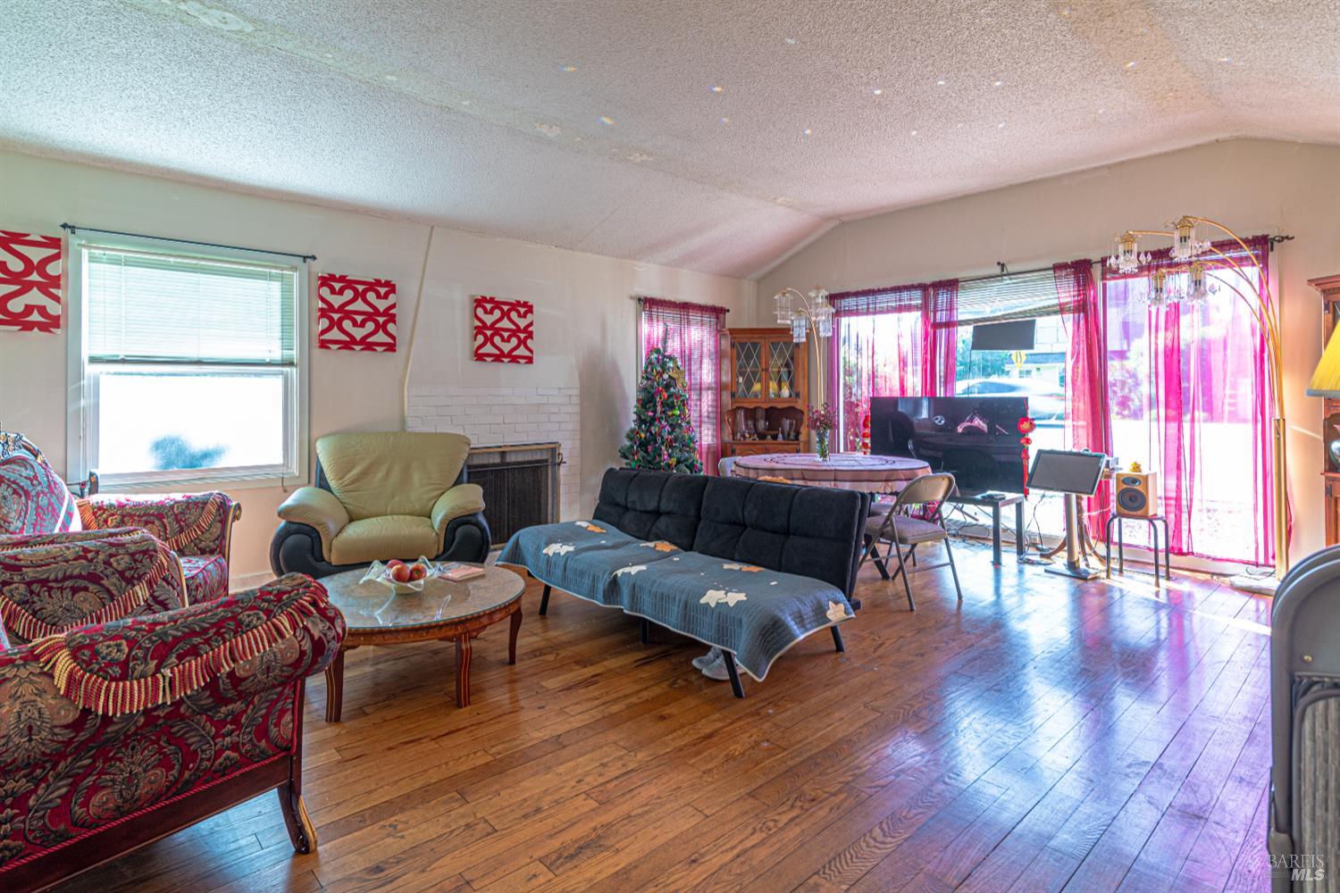 1852 4th Street Santa Rosa, CA 95404 - Photo 9 of 39 a living room with furniture and a wooden floor