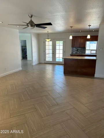 a view of large kitchen with a sink
