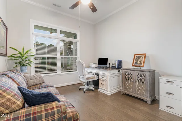 a workspace with furniture and a window