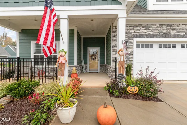 a view of front door and small potted plants