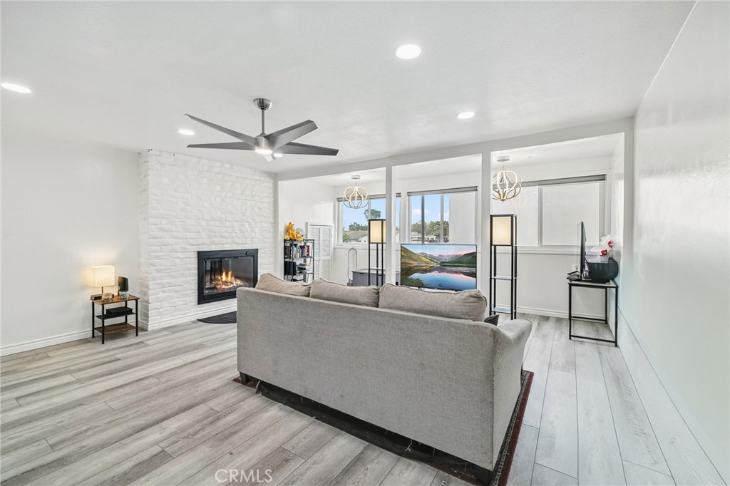 a living room with furniture and a fireplace
