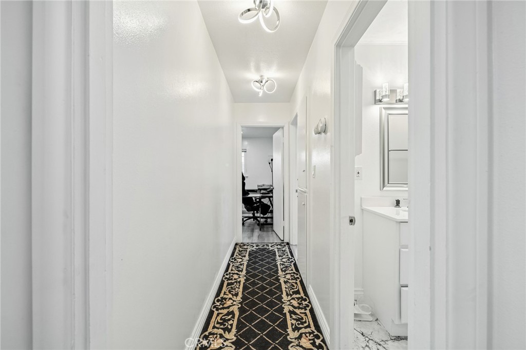 1349 Edgewood Way, Unit 49 Oxnard, CA 93030 - Photo 15 of 32 a view of a bathroom with a sink and mirror